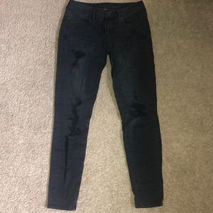 Black American Eagle jeans.